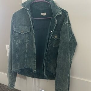 The color is a dark green and corduroy.